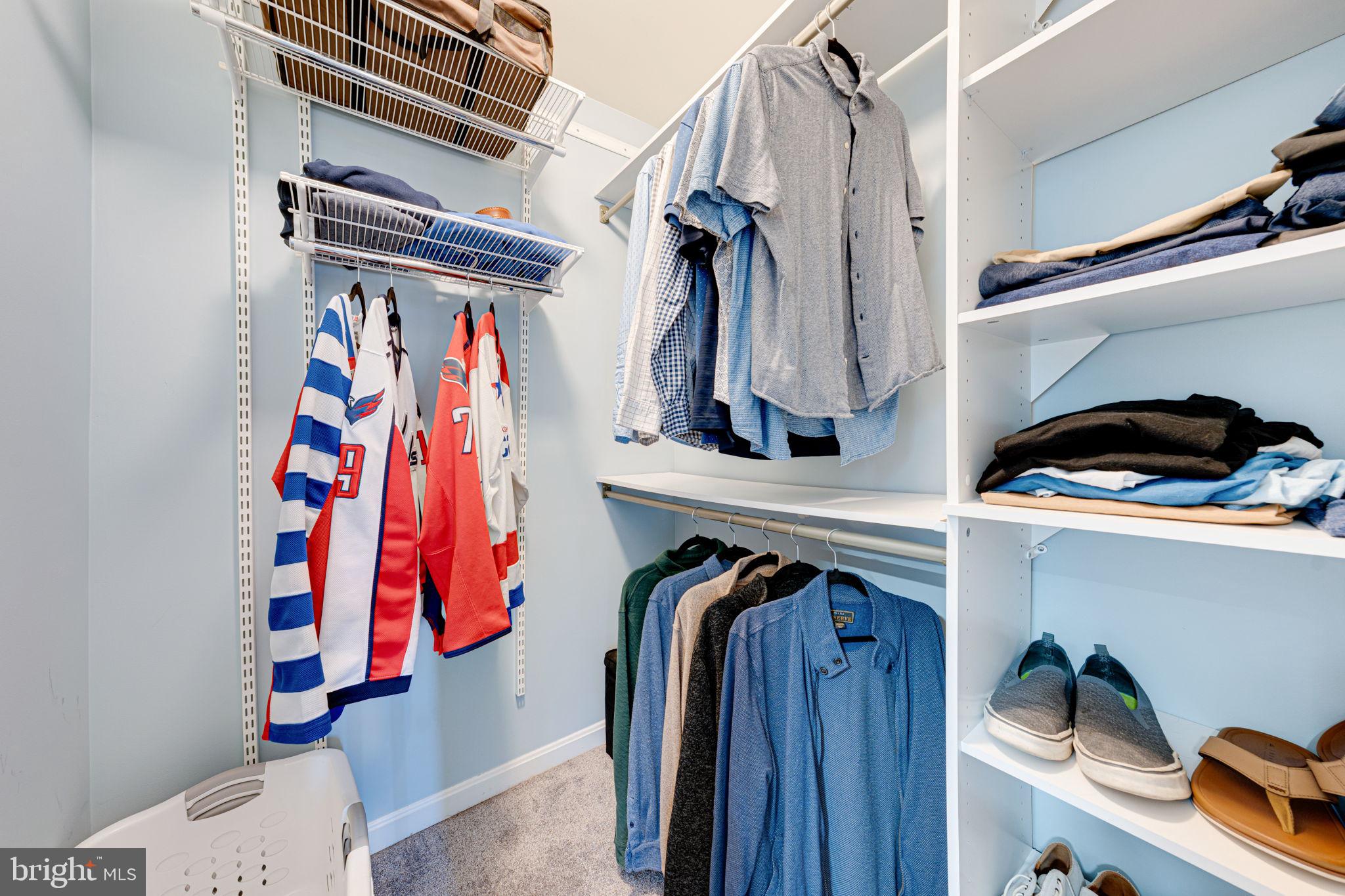 6911 Kerrywood Circle Centreville, VA 20121 - Photo 29 of 44 a view of walk in closet with clothes and shoes
