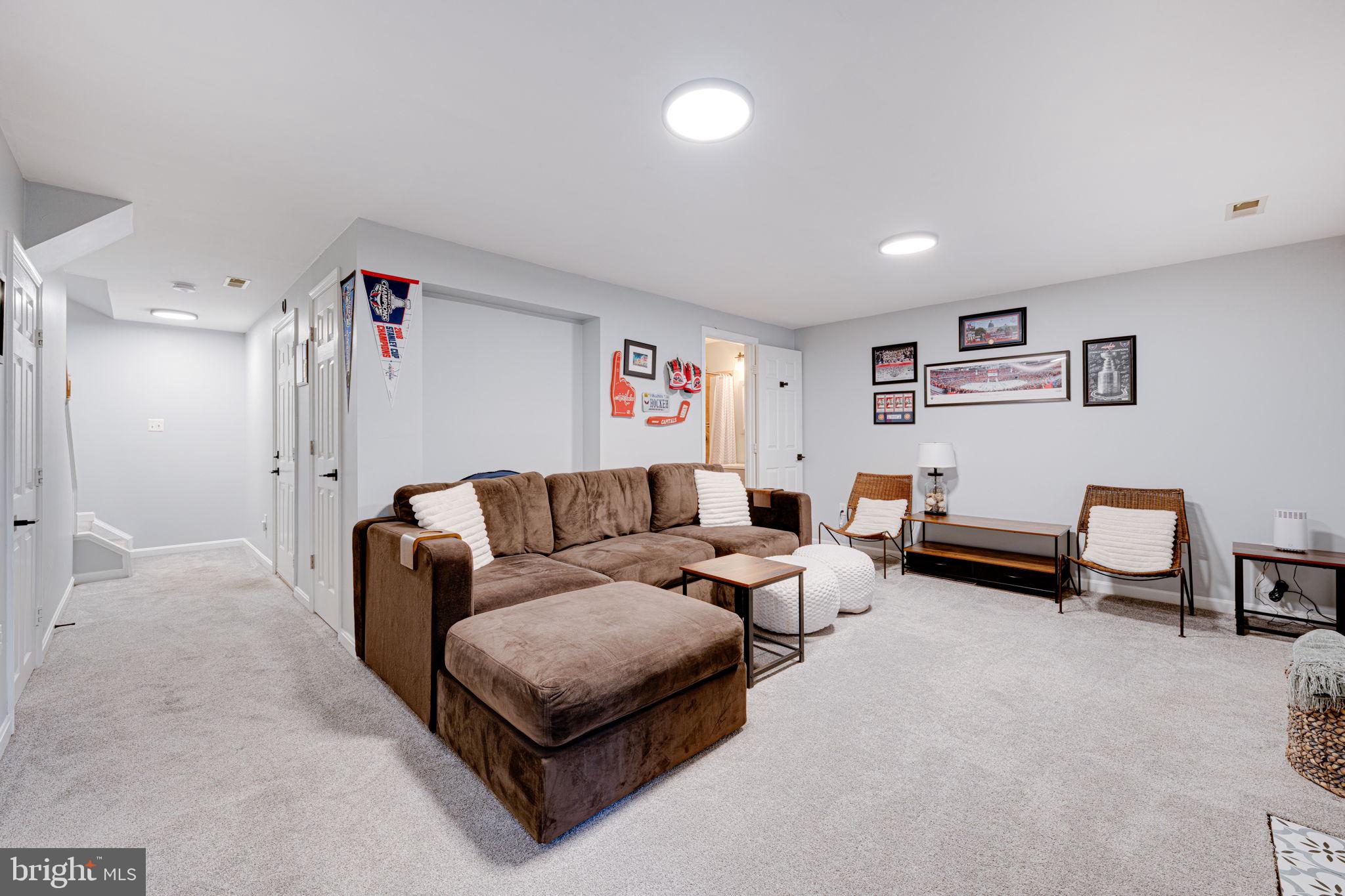 6911 Kerrywood Circle Centreville, VA 20121 - Photo 30 of 44 a living room with furniture and a couch
