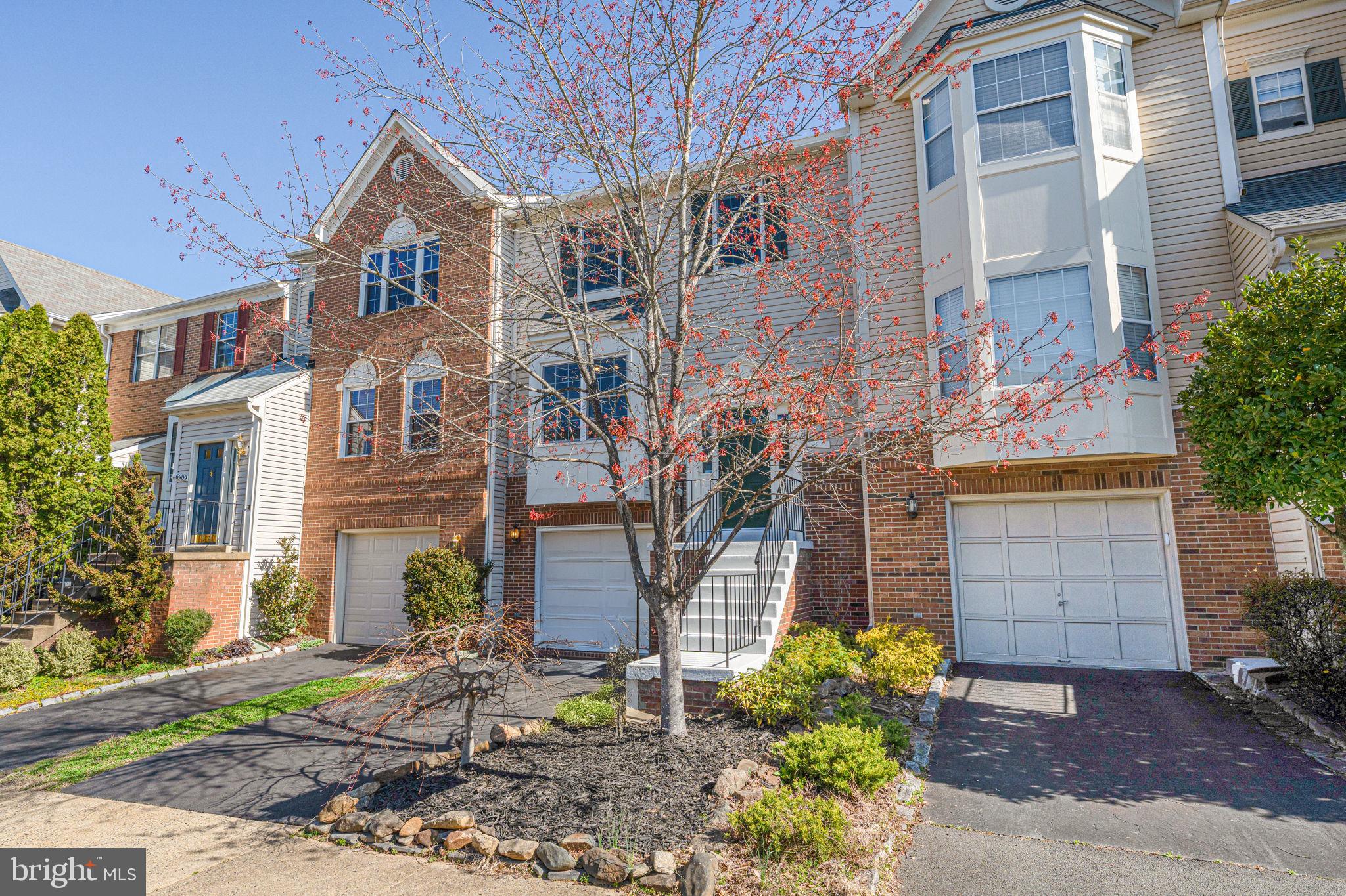6911 Kerrywood Circle Centreville, VA 20121 - Photo 3 of 44 a front view of a house with a yard