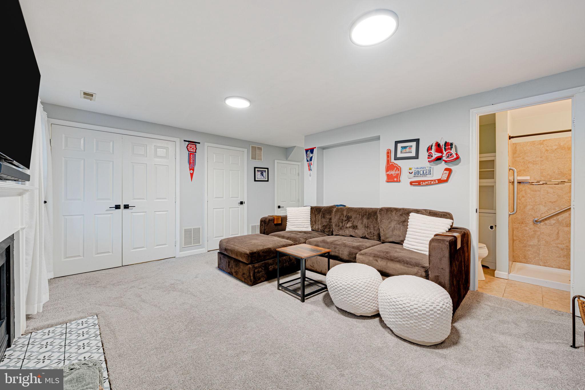 6911 Kerrywood Circle Centreville, VA 20121 - Photo 32 of 44 a living room with furniture and a flat screen tv