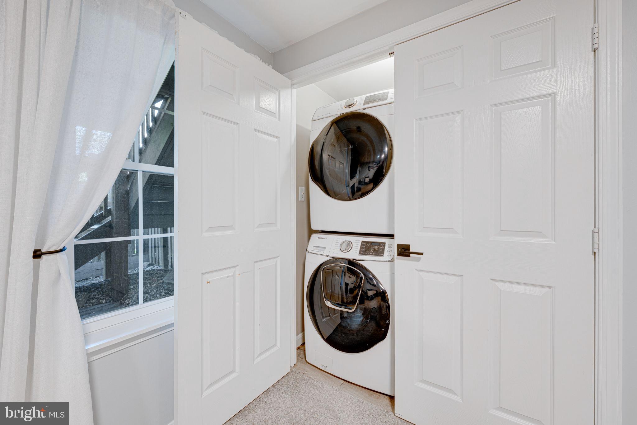 6911 Kerrywood Circle Centreville, VA 20121 - Photo 34 of 44 a view of a hallway with washer and dryer