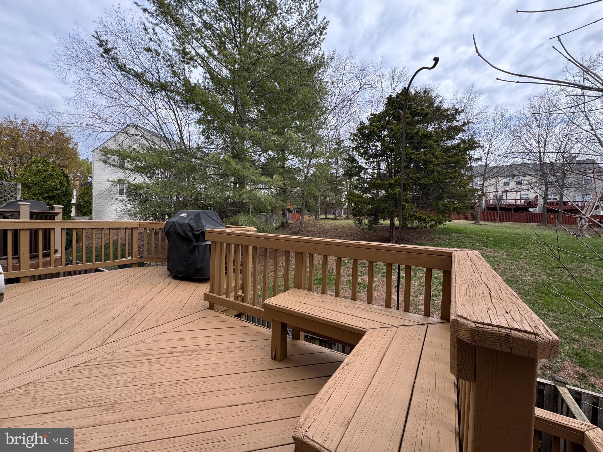 6911 Kerrywood Circle Centreville, VA 20121 - Photo 36 of 44 a view of roof deck with couches and trees