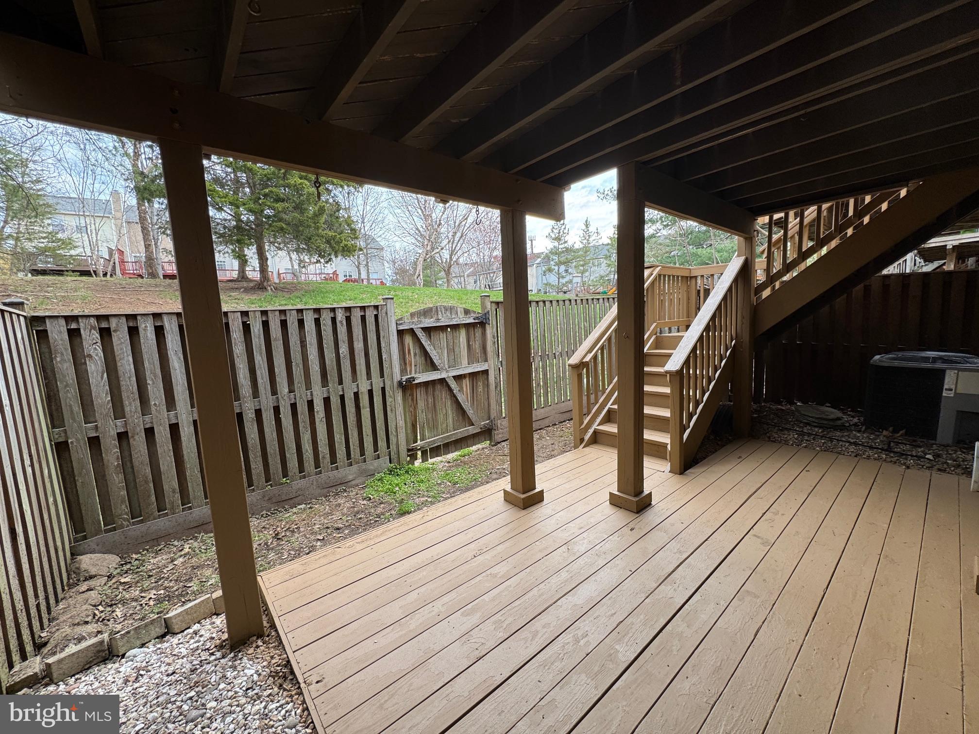 6911 Kerrywood Circle Centreville, VA 20121 - Photo 38 of 44 a view of deck with wooden floor and iron stairs