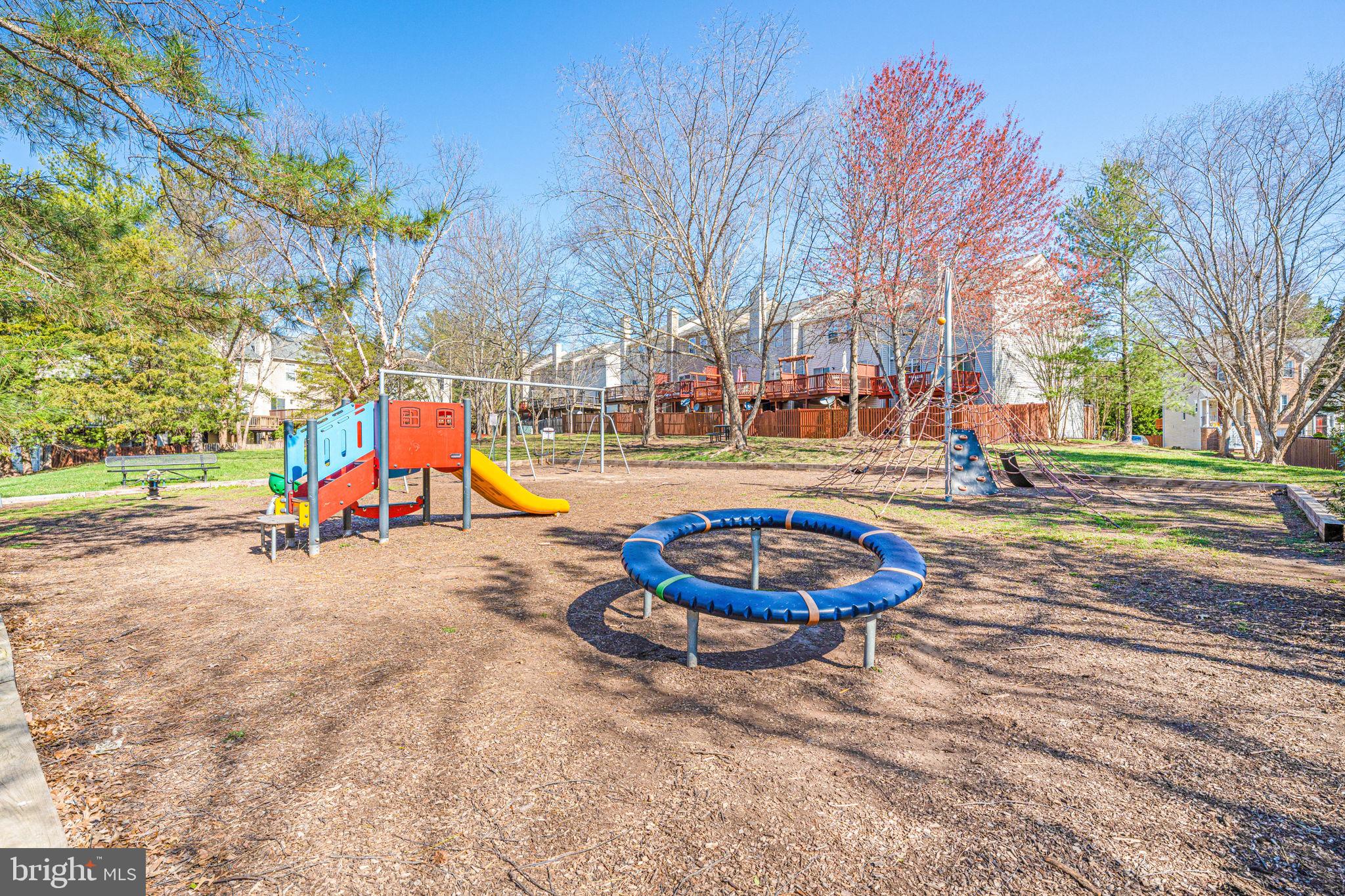 6911 Kerrywood Circle Centreville, VA 20121 - Photo 40 of 44 a view of a park with swings and slides