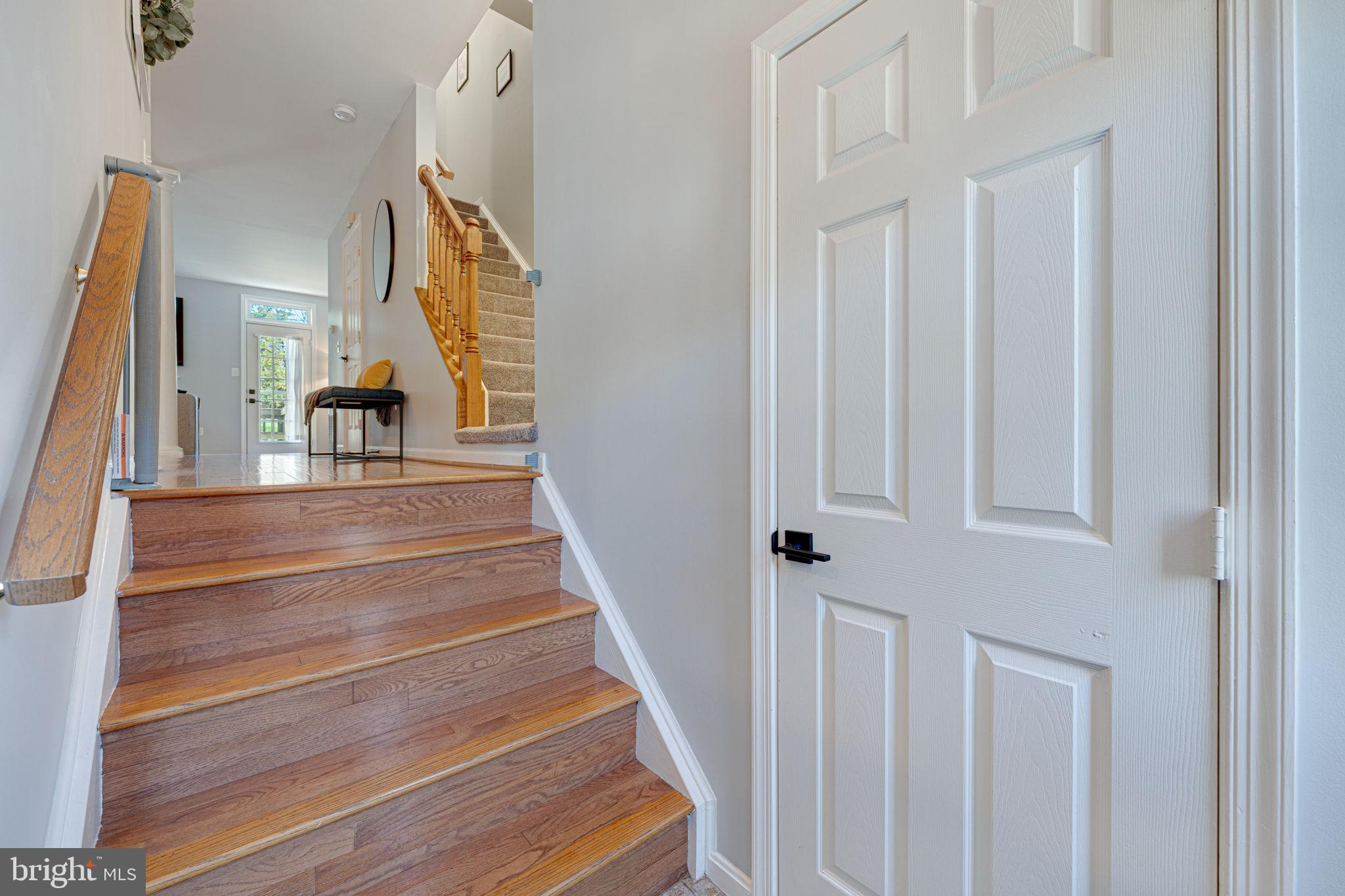 6911 Kerrywood Circle Centreville, VA 20121 - Photo 4 of 44 a view of staircase with white walls and railing
