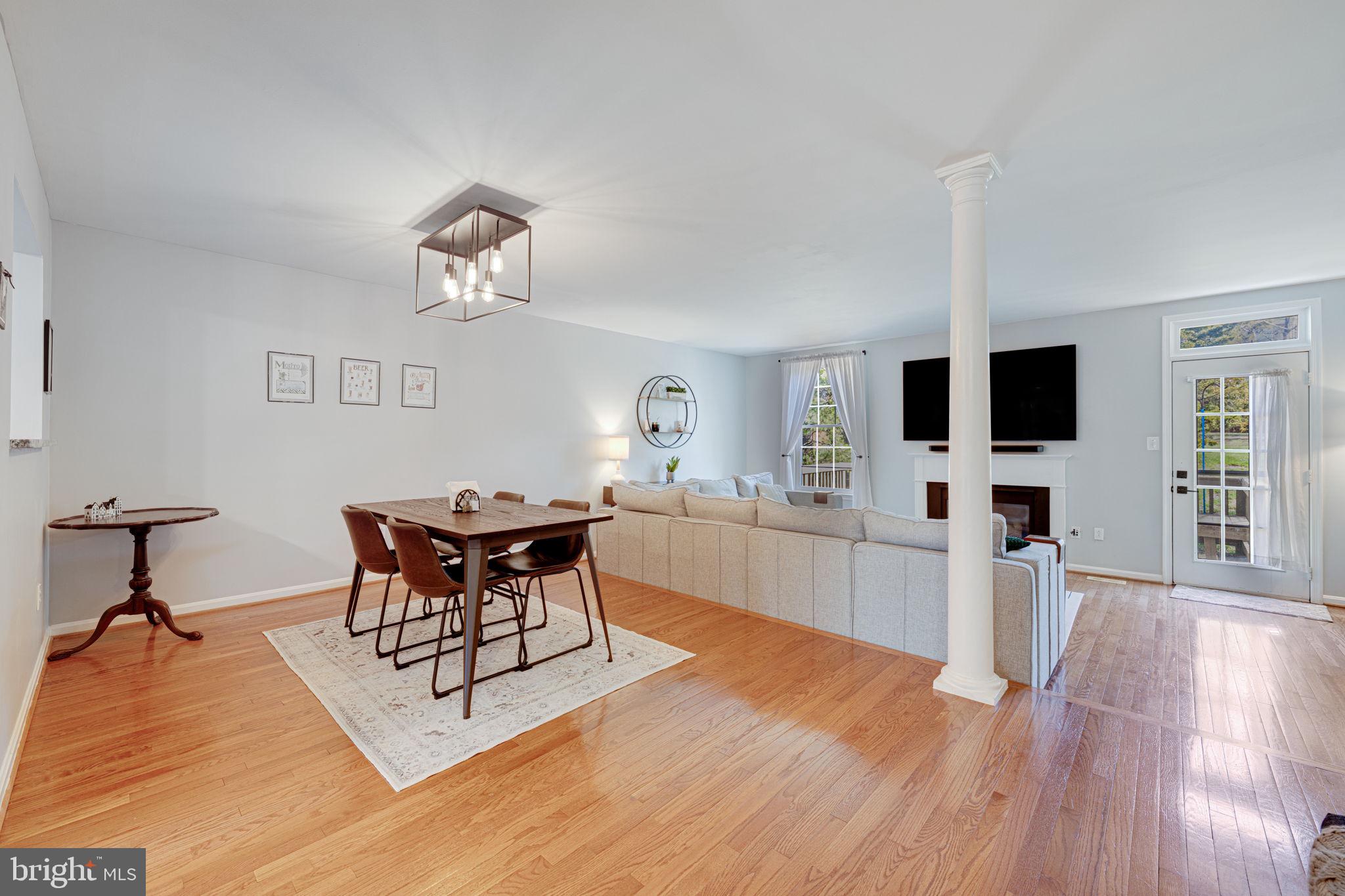 6911 Kerrywood Circle Centreville, VA 20121 - Photo 5 of 44 a living room with furniture fireplace and flat screen tv