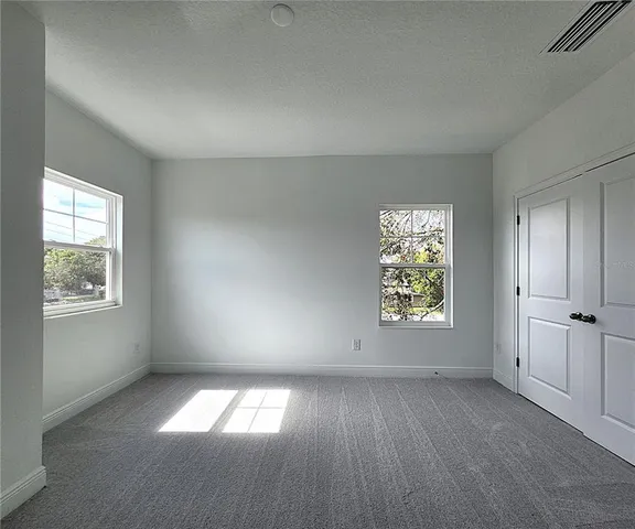 an empty room with windows