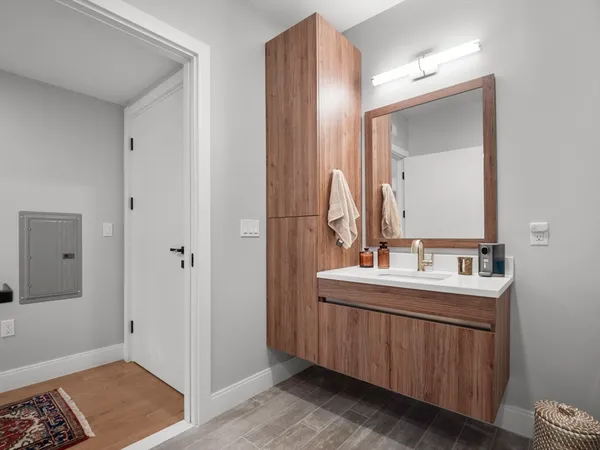 a bathroom with a sink and a mirror