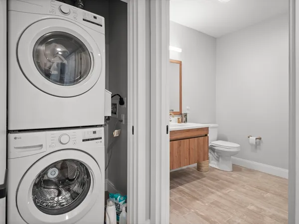 a bathroom with a toilet sink and vanity
