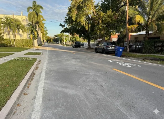 a view of a street with a building on both side of a road