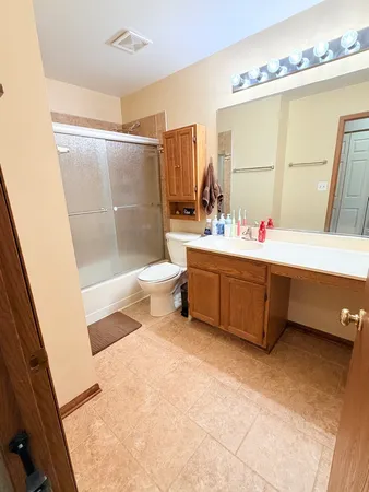 a bathroom with a bathtub sink and toilet