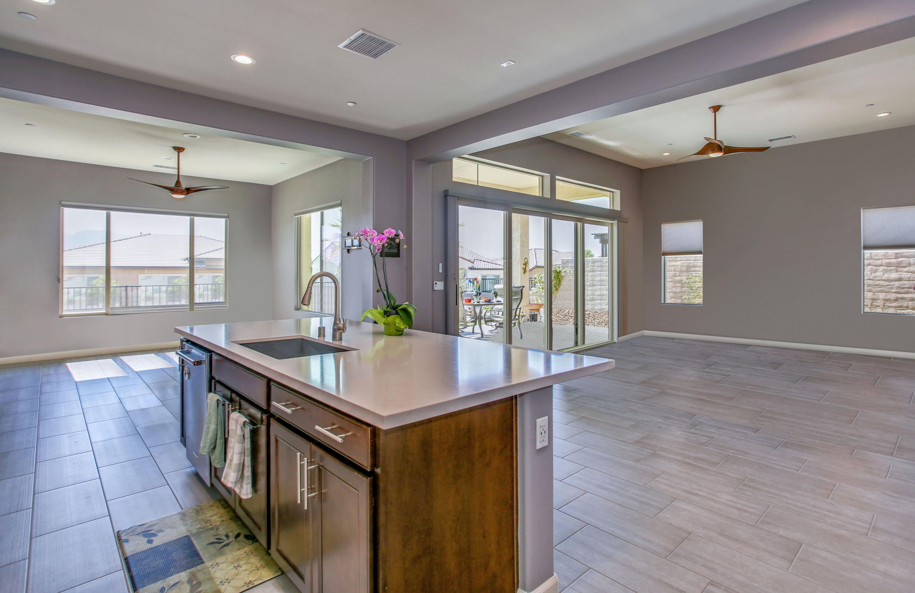 21 Riesling Rancho Mirage, CA 92270 - Photo 17 of 53 a view of kitchen island kitchen island a stove a wooden floor and a large window