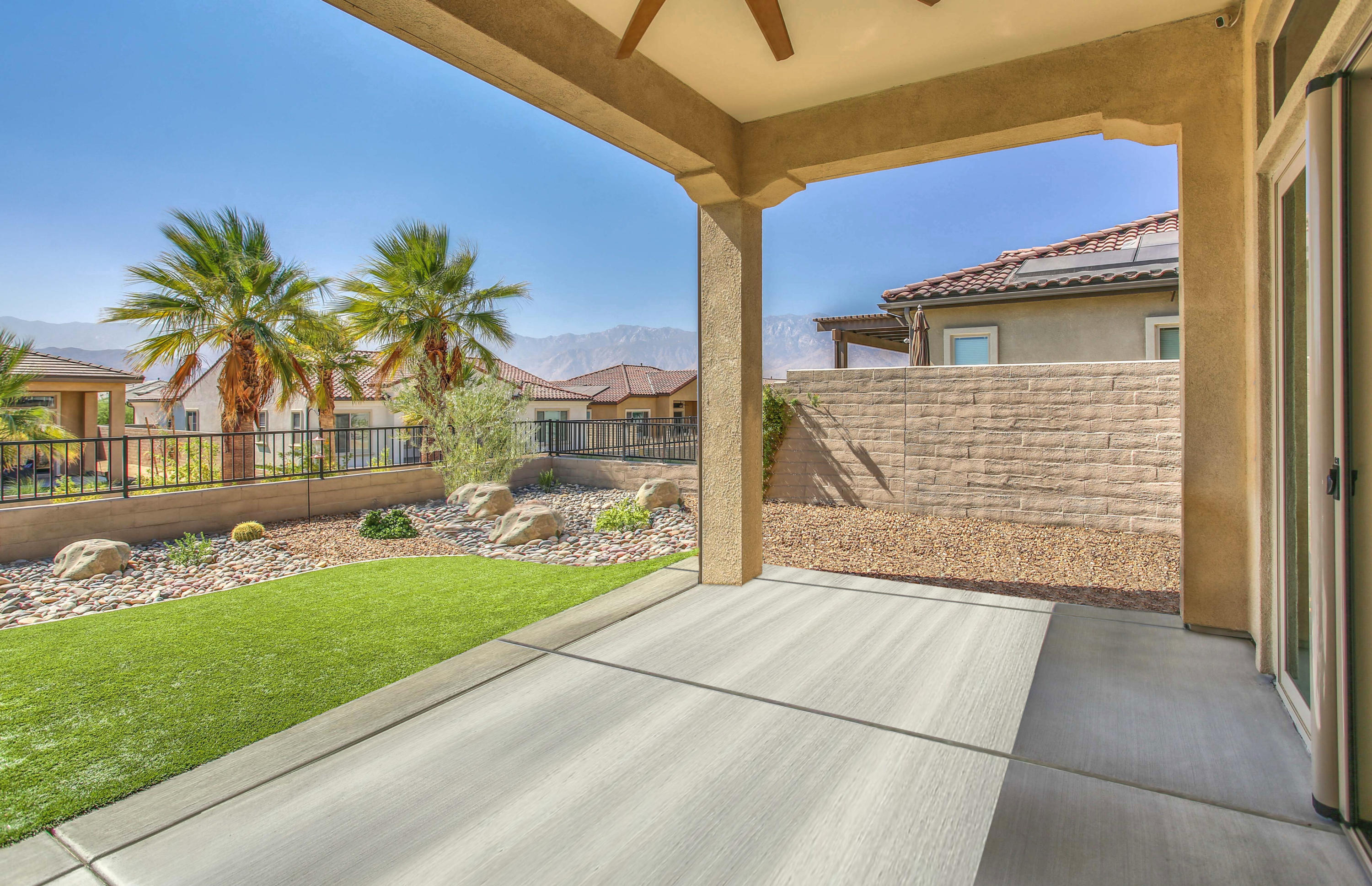 21 Riesling Rancho Mirage, CA 92270 - Photo 3 of 53 a front view of a house with a yard