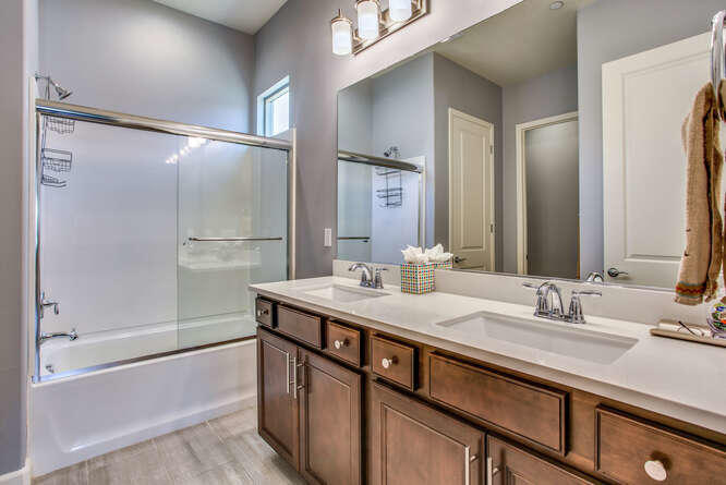 21 Riesling Rancho Mirage, CA 92270 - Photo 26 of 53 a bathroom with a double vanity sink mirror and shower
