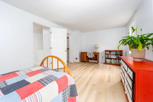 a bedroom with furniture and a bed