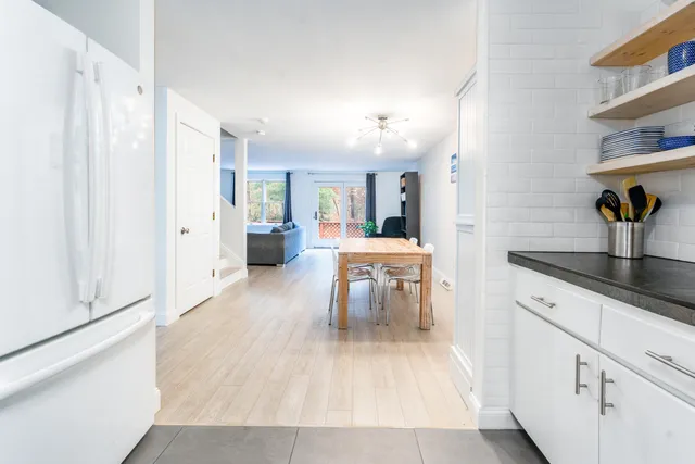 a view of a kitchen from the hallway