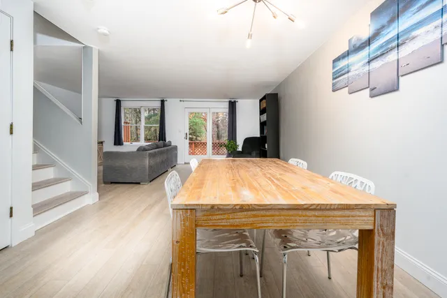 a view of kitchen with furniture and wooden floor