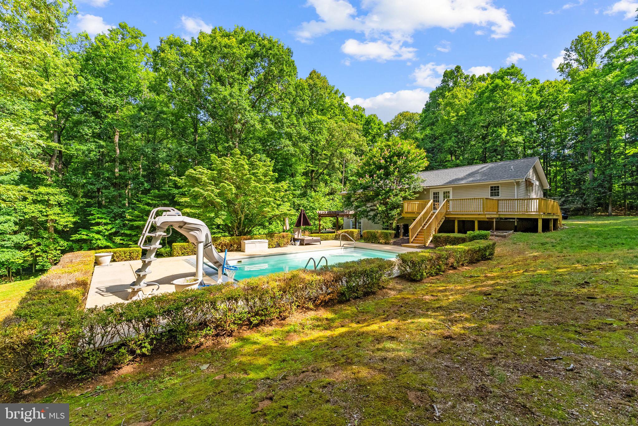 20065 Crooked Run Road Culpeper, VA 22701 - Photo 55 of 62 a house view with a swimming pool