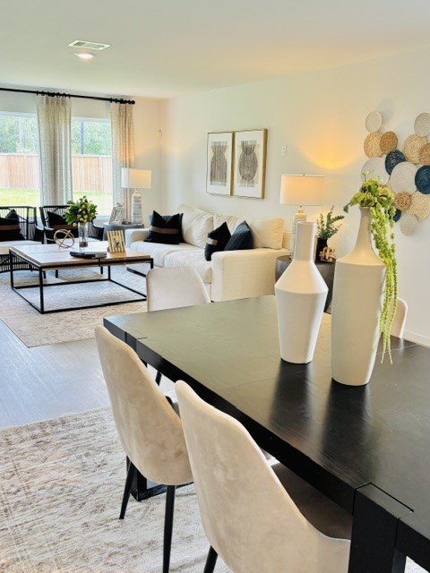 2126 Mosaic Vly Court Angleton, TX 77515 - Photo 14 of 40 a living room with furniture wooden floor and a potted plant