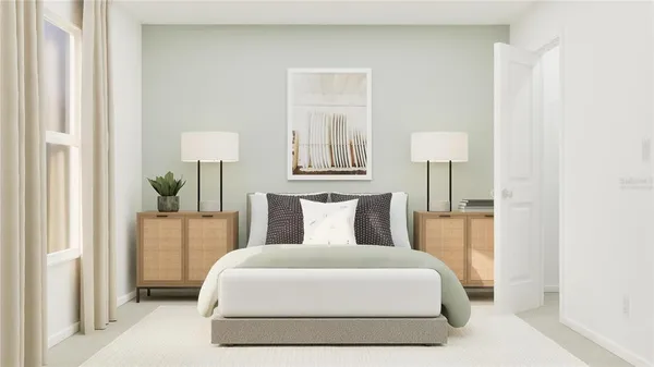 a bedroom with a bed and a lamp on table