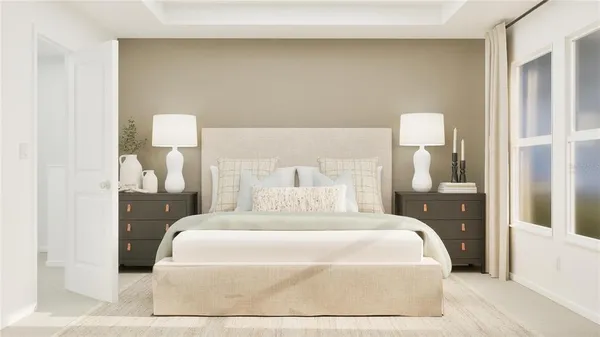 a large bed sitting in a bedroom next to a lamp