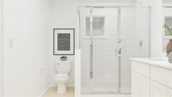 a bathroom with a toilet a sink and shower