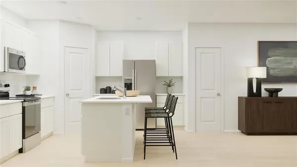 a kitchen with a stove and a refrigerator