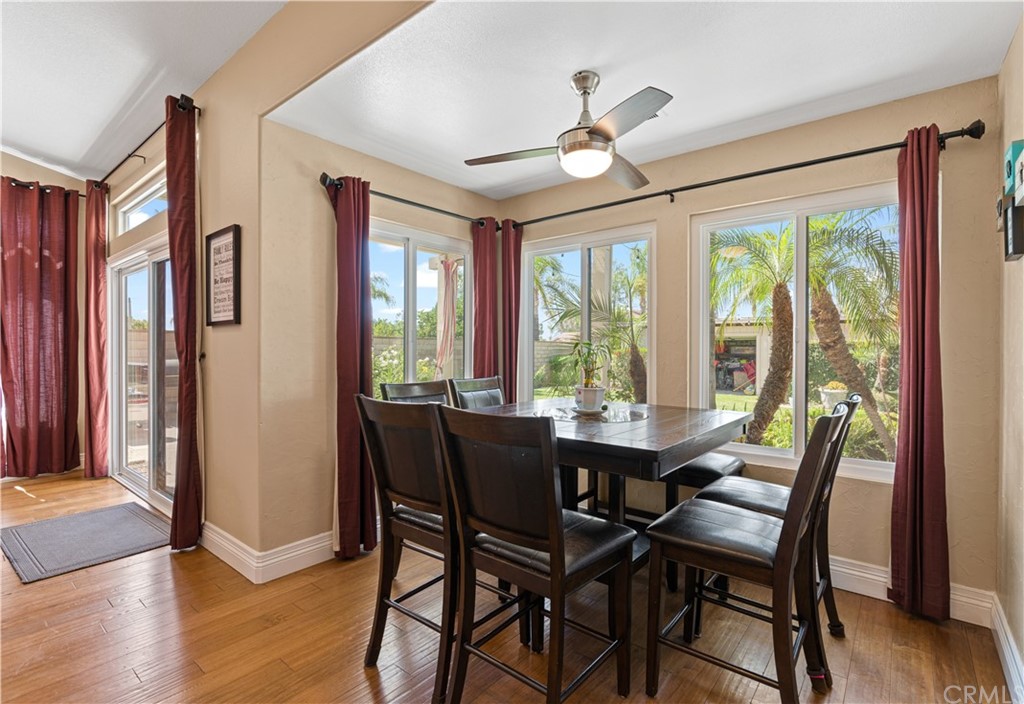 1879 Apostle Lane Riverside, CA 92506 - Photo 16 of 49 a view of a dining room with furniture window and wooden floor