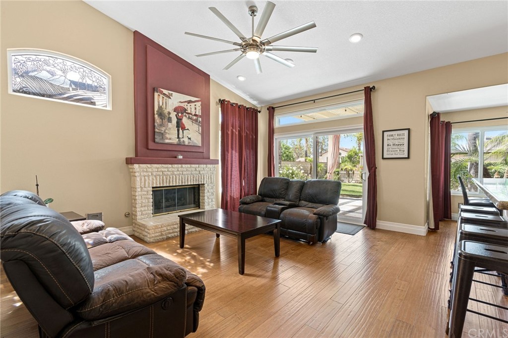 1879 Apostle Lane Riverside, CA 92506 - Photo 18 of 49 a living room with furniture and a fireplace