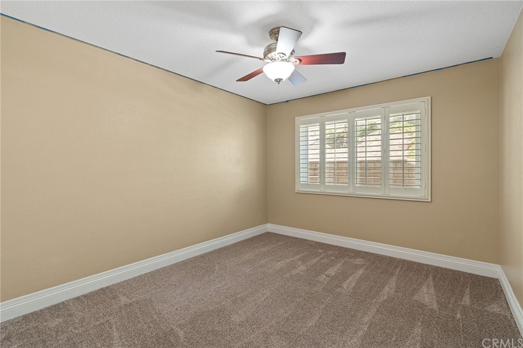 1879 Apostle Lane Riverside, CA 92506 - Photo 29 of 49 an empty room with windows and fan