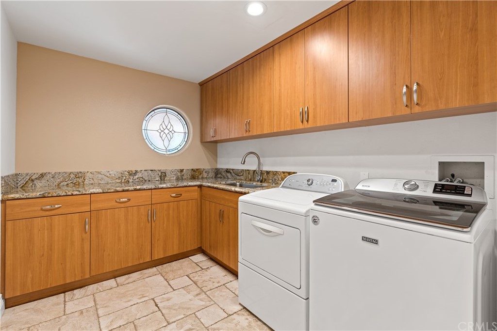 1879 Apostle Lane Riverside, CA 92506 - Photo 32 of 49 a utility room with dryer and washer
