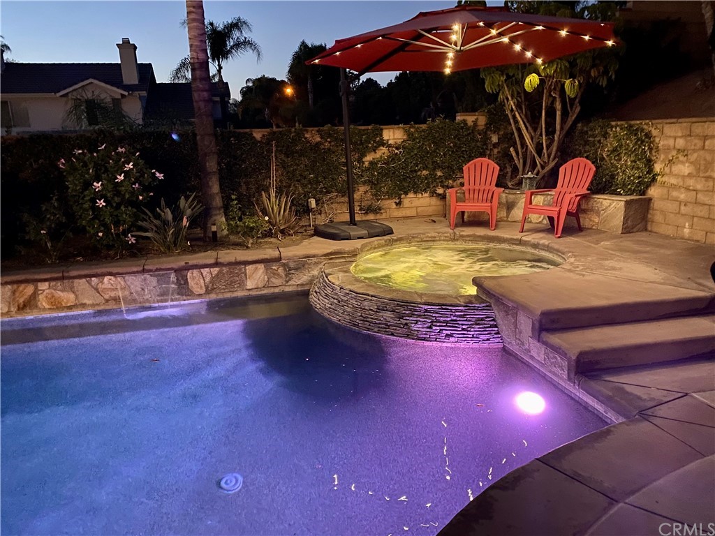1879 Apostle Lane Riverside, CA 92506 - Photo 43 of 49 a view of a patio with swimming pool