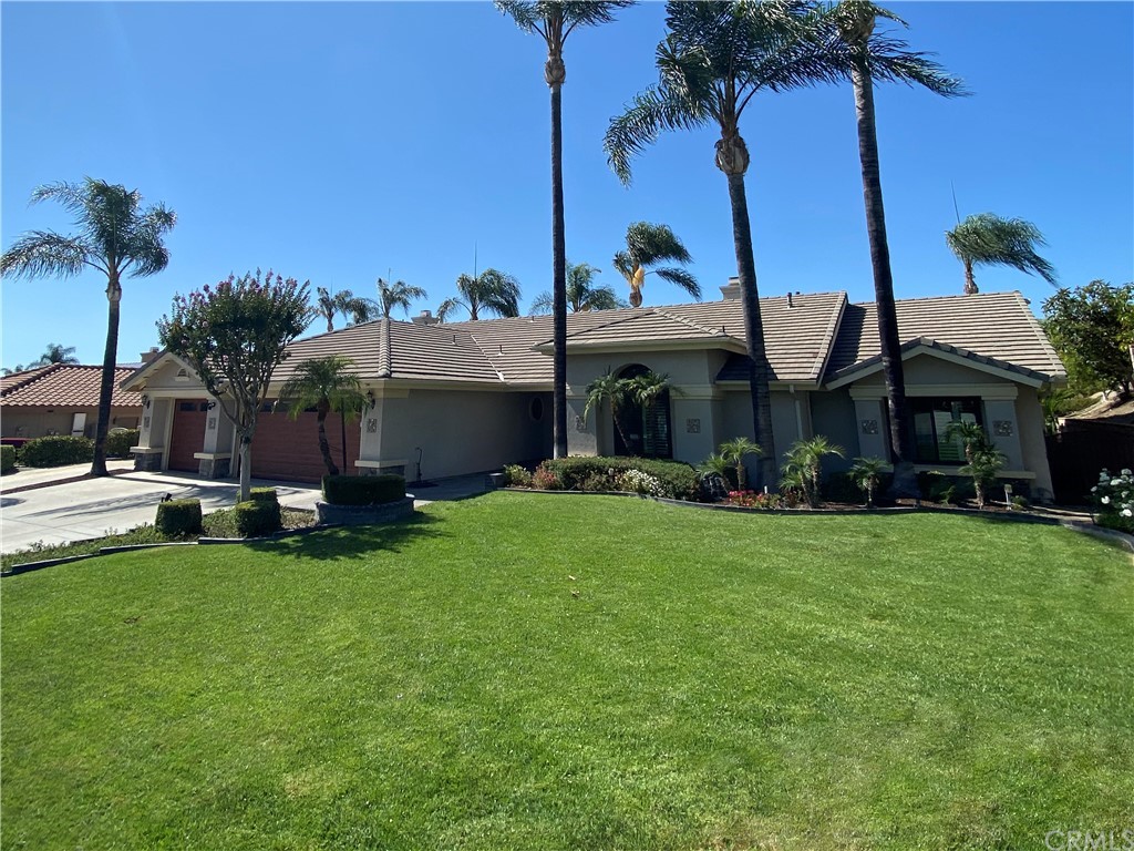 1879 Apostle Lane Riverside, CA 92506 - Photo 49 of 49 a view of a house with a backyard and a patio