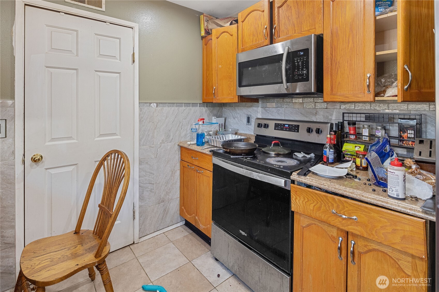 7025 Hannegan Road Lynden, WA 98264 - Photo 11 of 27 a kitchen with stainless steel appliances granite countertop a stove microwave and sink