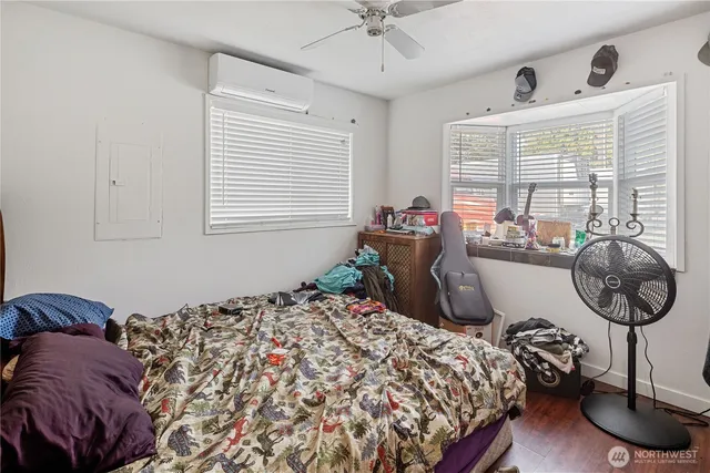 a bedroom with a bed and a window