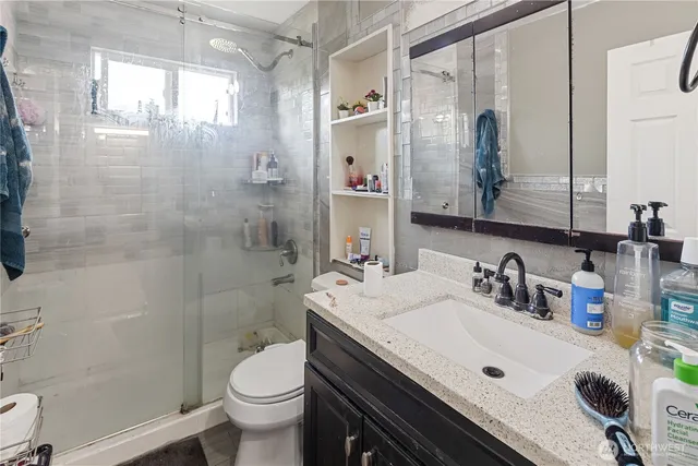 a view of a bathroom from a hallway