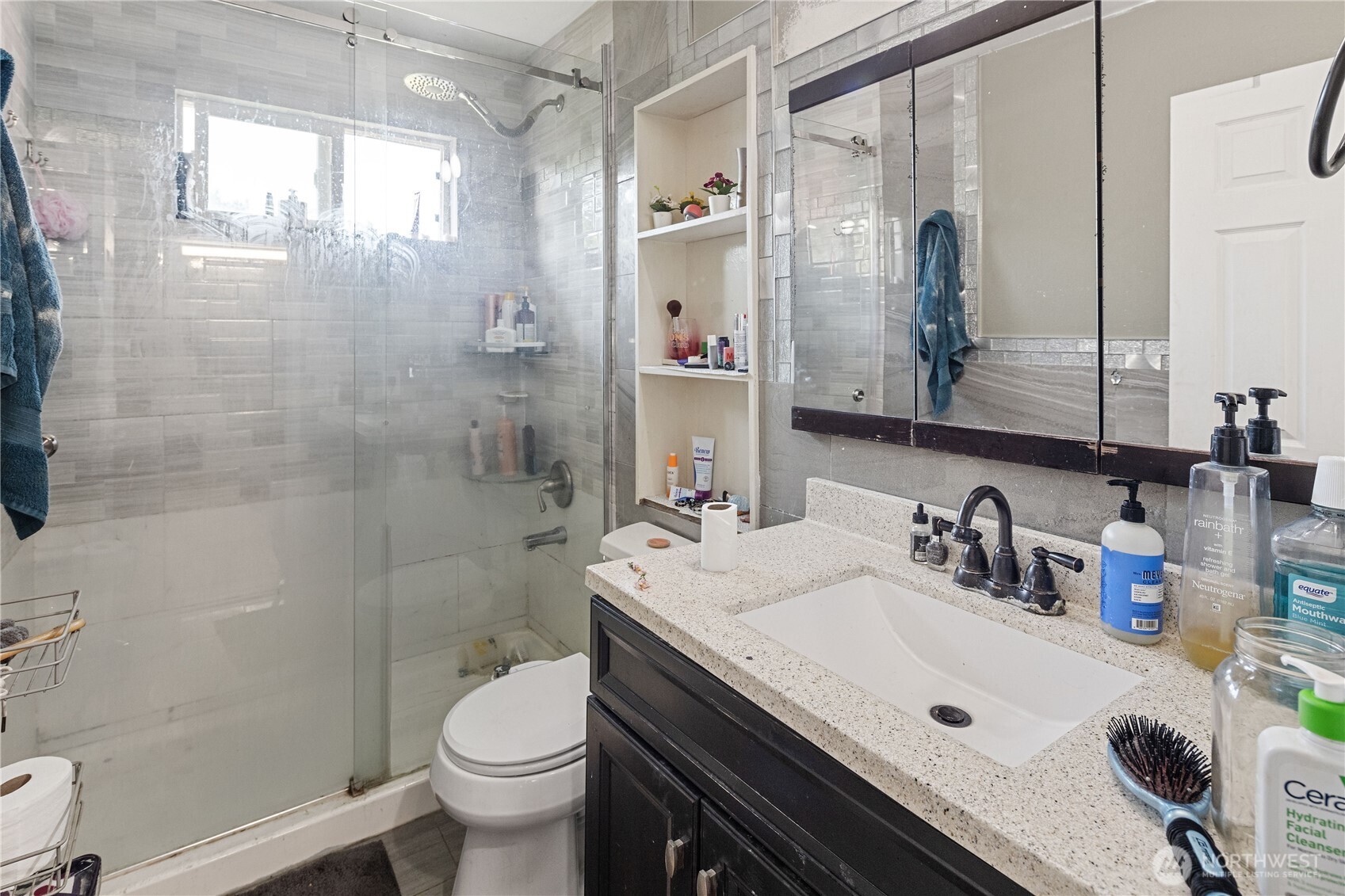 7025 Hannegan Road Lynden, WA 98264 - Photo 17 of 27 a bathroom with a sink a toilet and shower