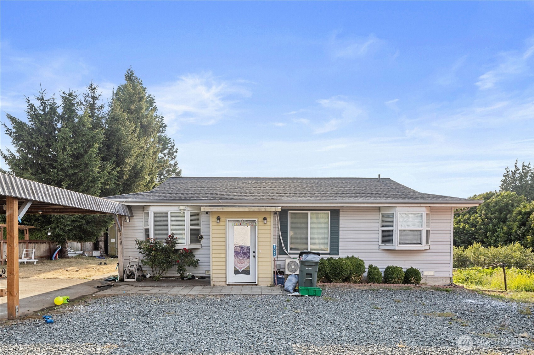 7025 Hannegan Road Lynden, WA 98264 - Photo 2 of 27 a view of a house with backyard and sitting area