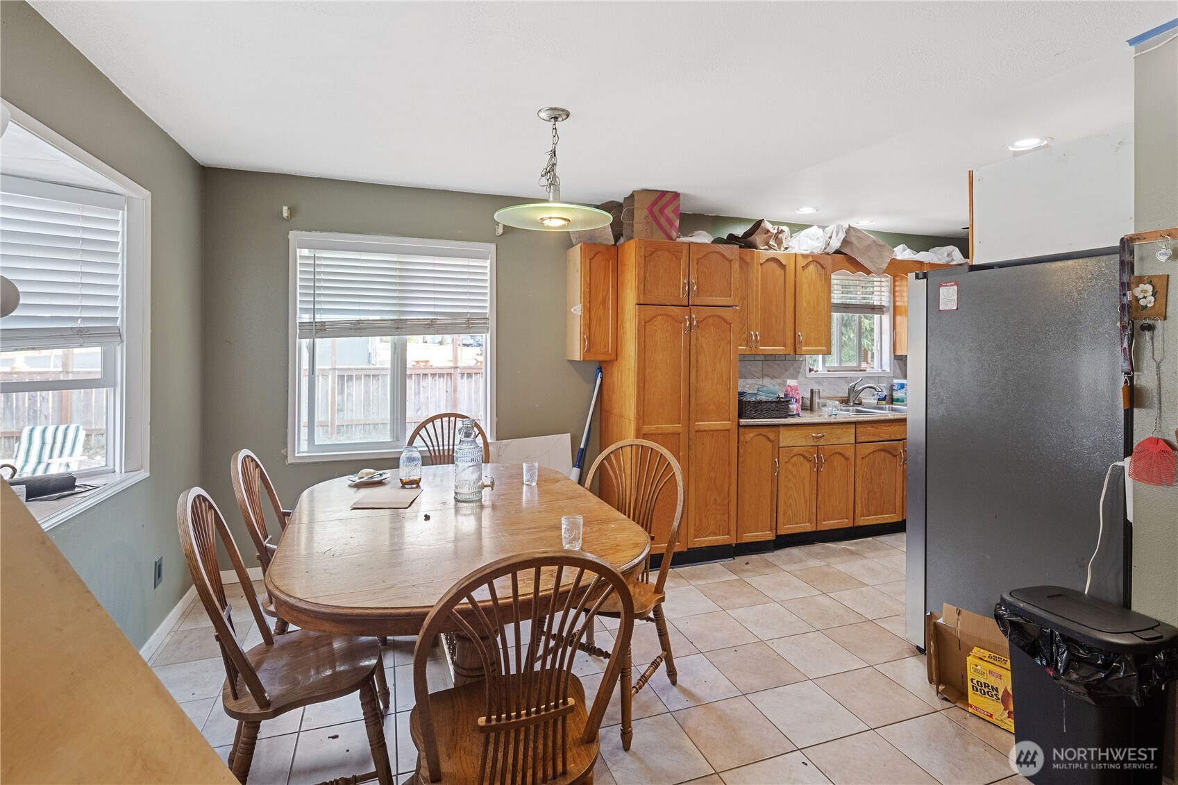 7025 Hannegan Road Lynden, WA 98264 - Photo 7 of 27 a dining room with furniture a chandelier and window
