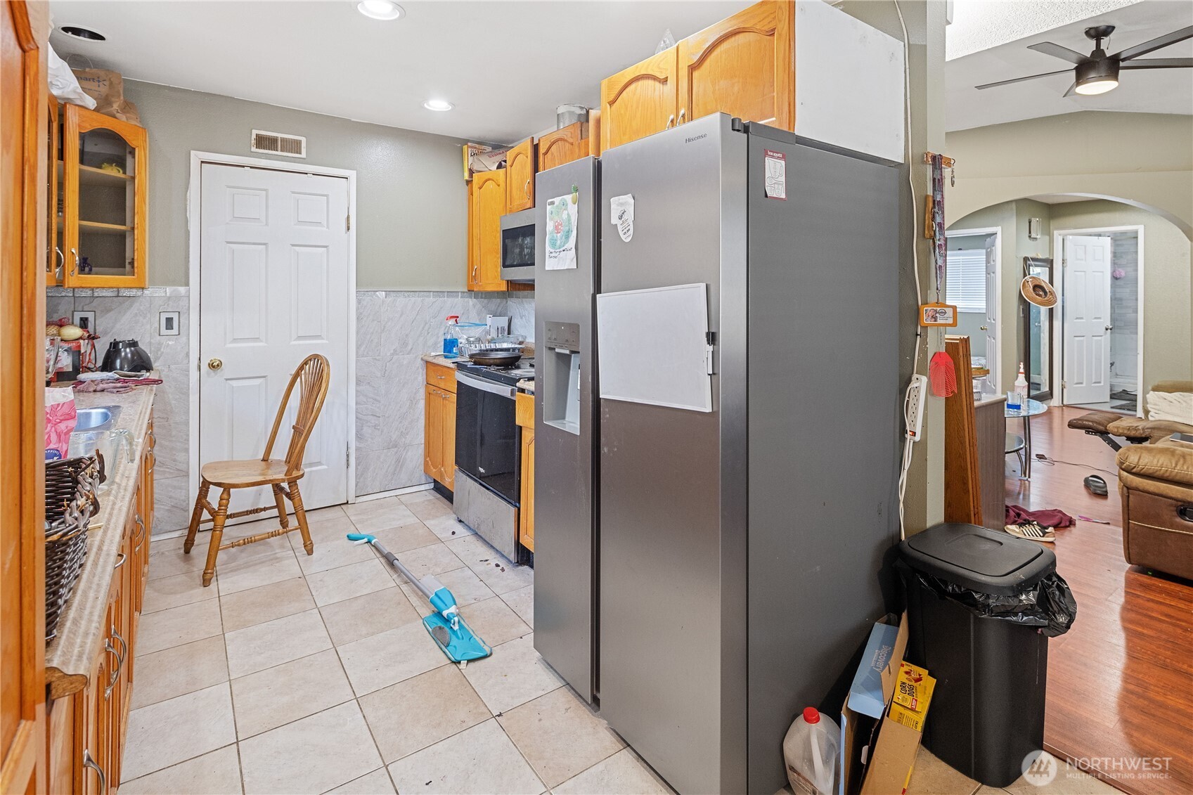 7025 Hannegan Road Lynden, WA 98264 - Photo 10 of 27 a kitchen with stainless steel appliances a refrigerator and a view of living room