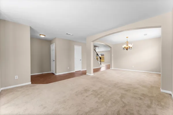 a view of a big room with closet and windows
