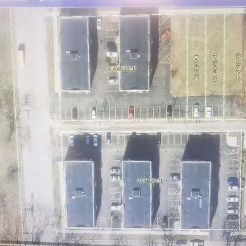 a large kitchen with stainless steel appliances kitchen island granite countertop a microwave and cabinets