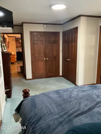 a bedroom with a bed and furniture