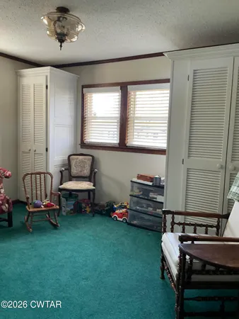 a room with furniture and a window