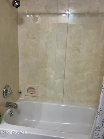a bathroom with a bathtub