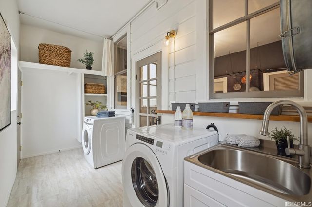 a kitchen with a refrigerator and a sink