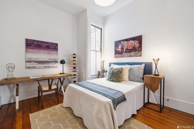 a bedroom with a bed and a table in it