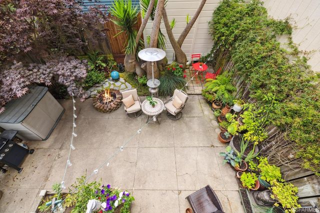 a row of palm trees in front of house