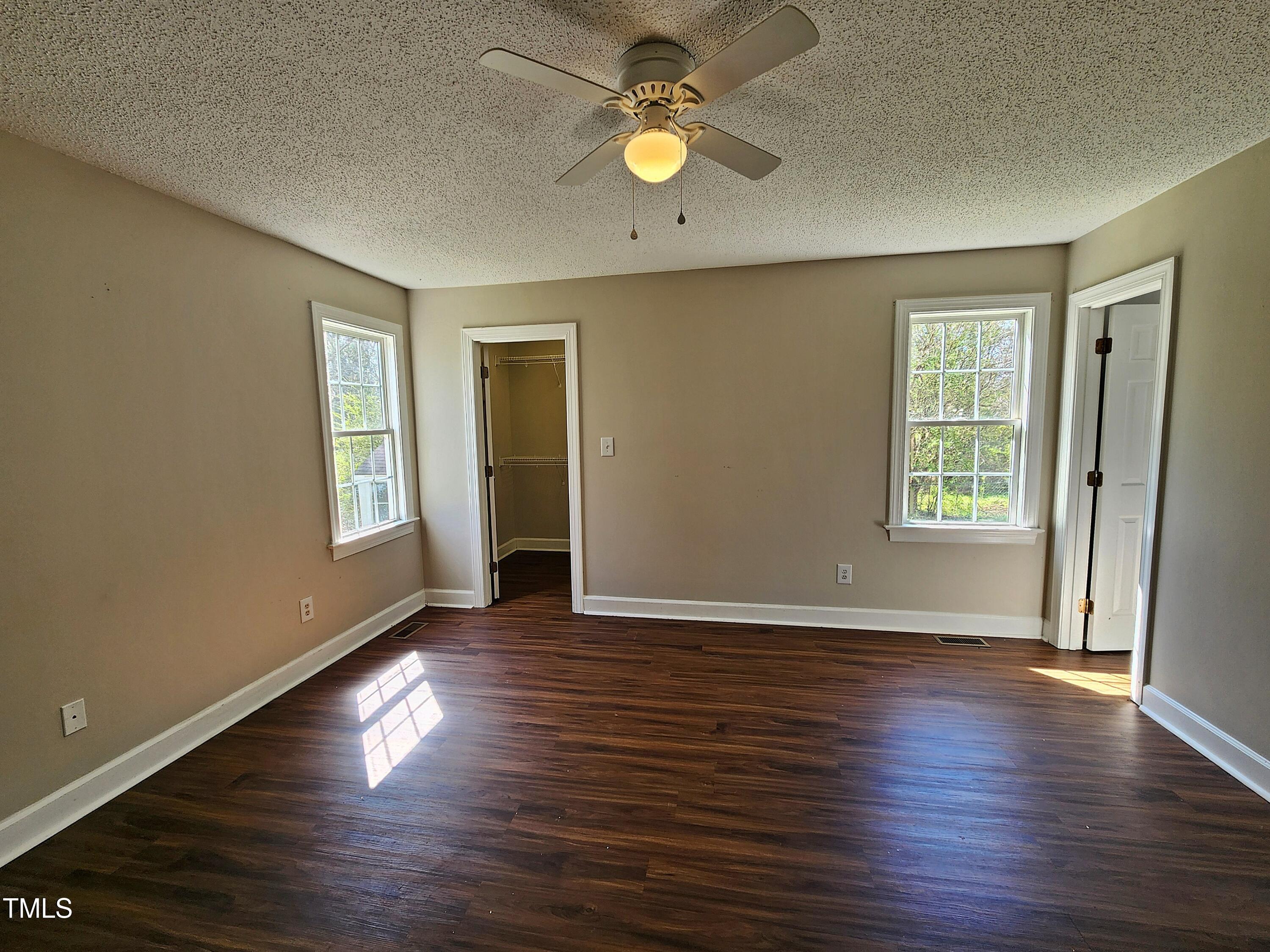 120 Keith Court Willow Spring, NC 27592 - Photo 16 of 25 an empty room with wooden floor and windows