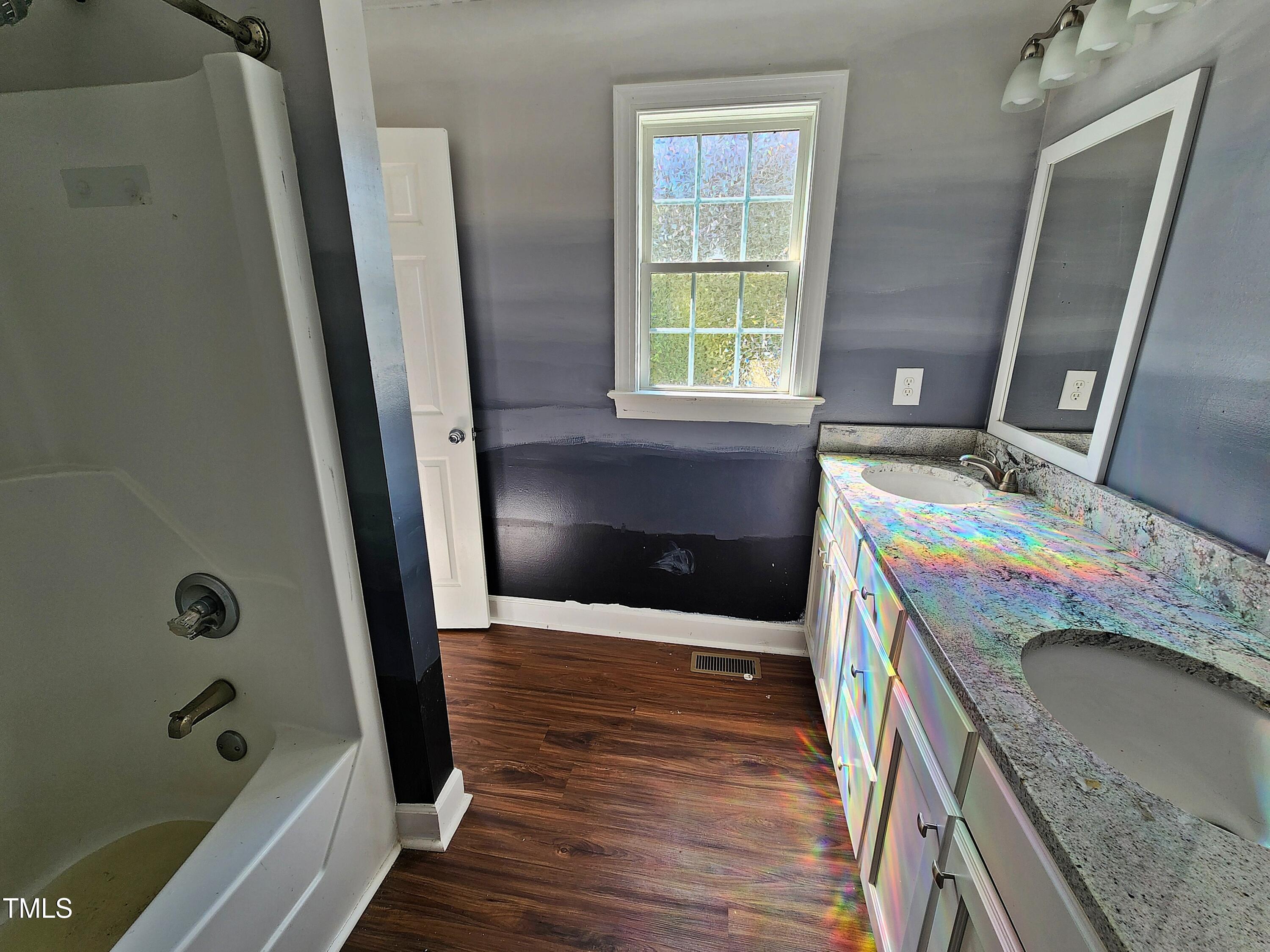 120 Keith Court Willow Spring, NC 27592 - Photo 18 of 25 a bathroom with a sink a washer and dryer